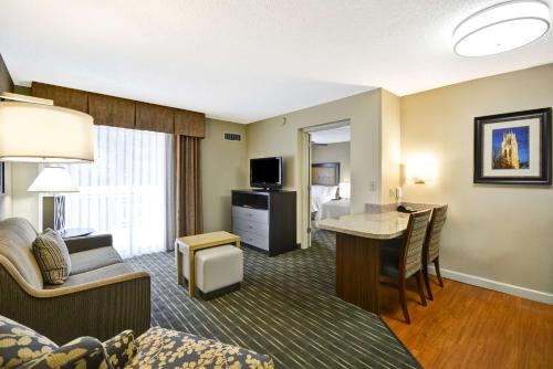 a hotel room with a bed and a desk in a room at Homewood Suites Durham-Chapel Hill I-40 in Durham