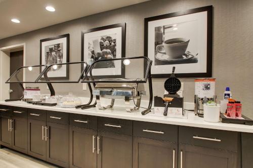 a salon counter with a barber chair and other cosmetics at Hampton Inn & Suites By Hilton Knightdale Raleigh in Raleigh