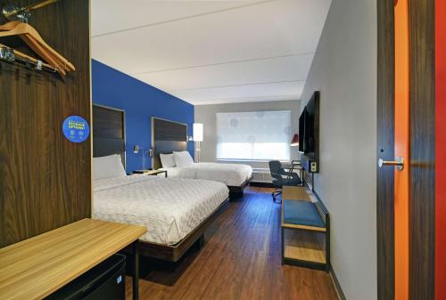 Ένα ή περισσότερα κρεβάτια σε δωμάτιο στο Tru By Hilton Burlington