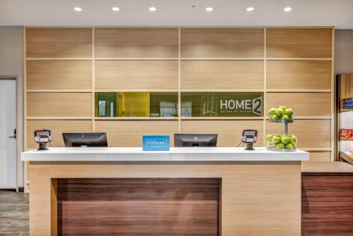 a lobby of a home store with a counter at Home2 Suites by Hilton Raleigh West Lenovo Center in Raleigh