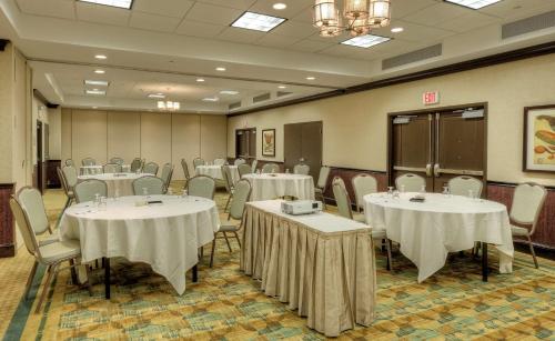 a banquet room with tables and chairs with white table cloth at Hilton Garden Inn Durham Southpoint in Durham