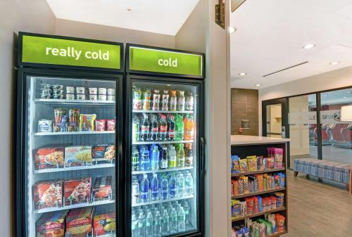 a refrigerator filled with lots of drinks in a store at Home2 Suites By Hilton Raleigh Durham Airport RTP in Durham
