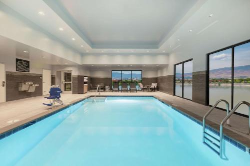 a swimming pool in a hotel with a view of the water at Hampton Inn & Suites Reno/Sparks in Reno