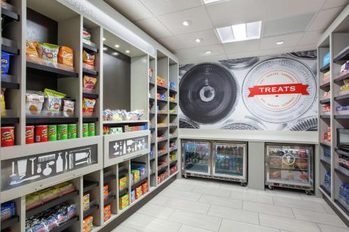 a grocery store aisle with a treats sign on the wall at Hampton Inn & Suites Reno/Sparks in Reno