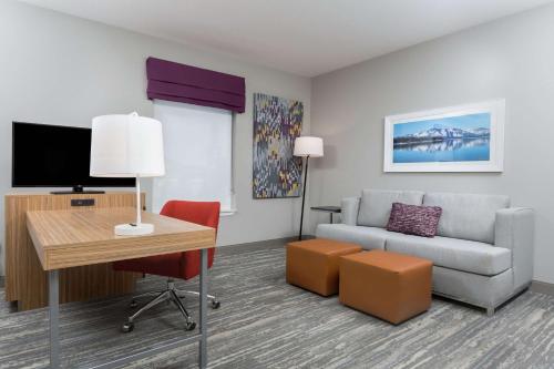 a living room with a couch and a table at Hampton Inn & Suites Reno/Sparks in Reno
