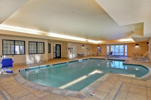 a large swimming pool in a hotel room at Homewood Suites by Hilton Reno in Reno