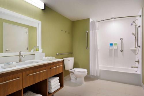 a bathroom with a sink and a toilet and a shower at Home2 Suites by Hilton Roanoke in Roanoke