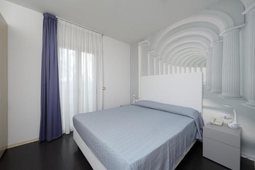 A bed or beds in a room at Hotel Anapaya