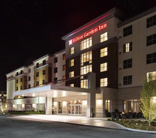 a rendering of a hotel exterior at night at Hilton Garden Inn Rochester - University & Medical Center in Rochester