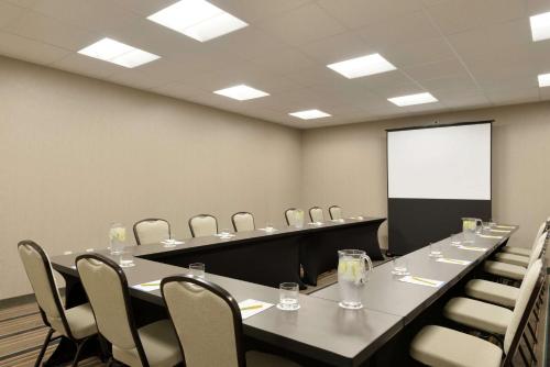 a conference room with a long table and chairs at Hilton Garden Inn Rochester - University & Medical Center in Rochester
