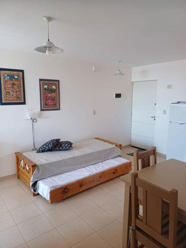 a bedroom with a bed in a white room at tu lugar 2 in Córdoba