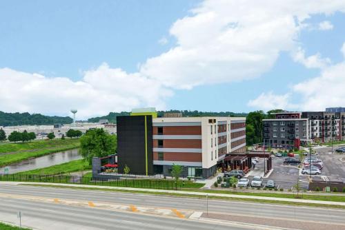 a rendering of a building next to a highway at Home2 Suites by Hilton Rochester Mayo Clinic Area in Rochester