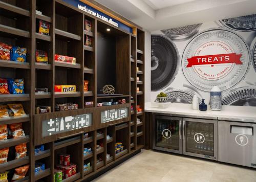 a grocery store with a treats sign on the wall at Hampton Inn & Suites El Cajon San Diego in El Cajon