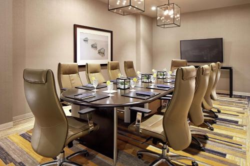 a conference room with a table and chairs at Hilton San Diego Mission Valley in San Diego