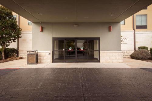 a lobby of a building with a large glass door at Homewood Suites by Hilton San Antonio North in San Antonio