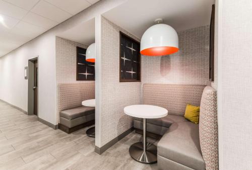 a waiting room with two tables and two chairs at Hampton Inn & Suites Benton Harbor, MI in Benton Harbor