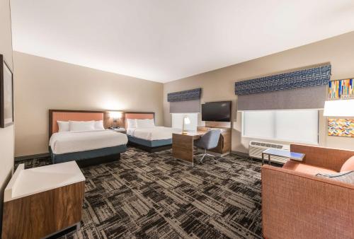 a hotel room with two beds and a flat screen tv at Hampton Inn & Suites Benton Harbor, MI in Benton Harbor