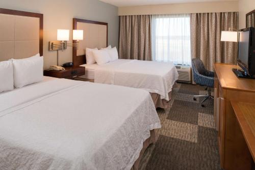 Ένα ή περισσότερα κρεβάτια σε δωμάτιο στο Hampton Inn and Suites Schertz