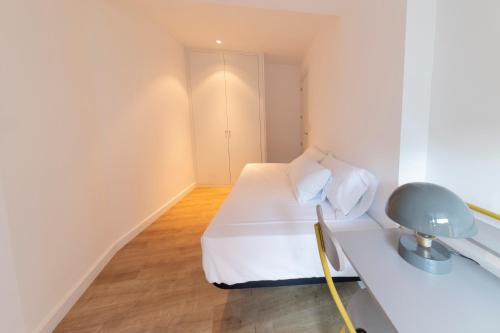 Postel nebo postele na pokoji v ubytování DWO Ábaster Suites