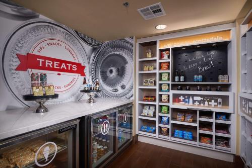 a coffee shop with a treats sign on the wall at Hampton Inn & Suites Phoenix/Scottsdale in Scottsdale
