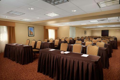 a conference room with rows of chairs and tables at Hampton Inn & Suites Phoenix/Scottsdale in Scottsdale