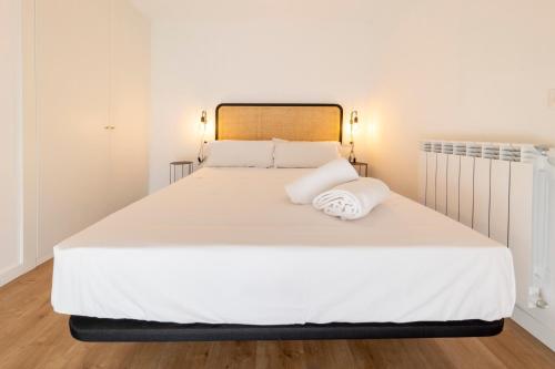 Postel nebo postele na pokoji v ubytování DWO Ábaster Suites