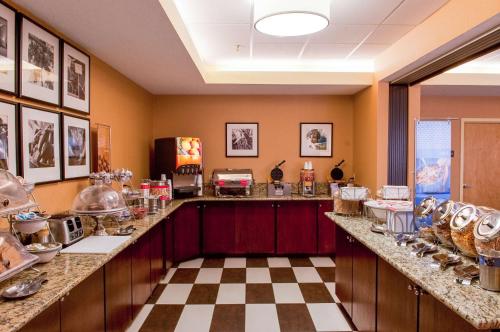 a kitchen with a counter with dishes on it at Hampton Inn Clarksville in Clarksville