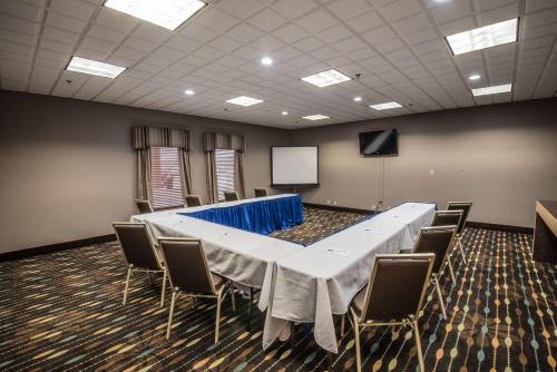 a conference room with a long table and chairs at Hampton Inn Clarksville in Clarksville