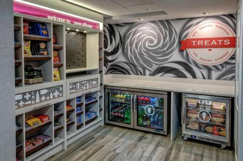 a food section of a grocery store with refrigerators at Hampton Inn New Albany Louisville West in New Albany