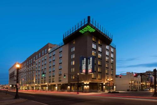 a building with a sign on the top of it at Hilton Garden Inn Louisville Downtown in Louisville