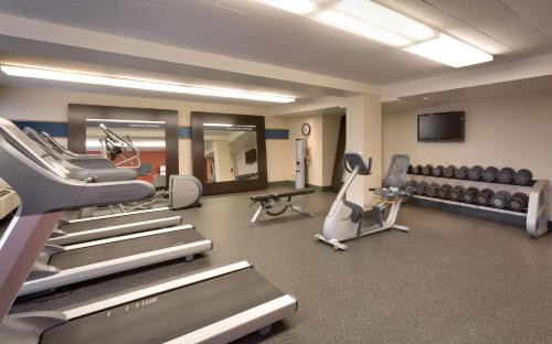 a gym with treadmills and machines in a room at Hampton Inn Salt Lake City/Sandy in Sandy