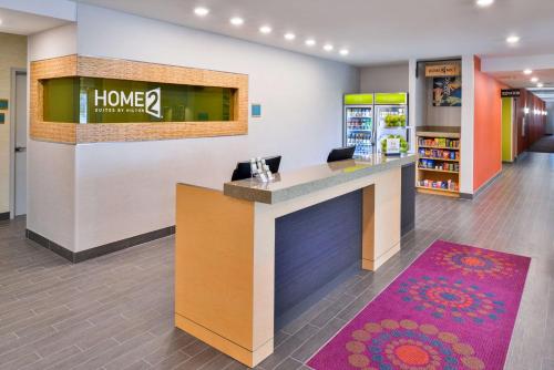 a lobby of a home store with a reception desk at Home2 Suites By Hilton DuPont in DuPont