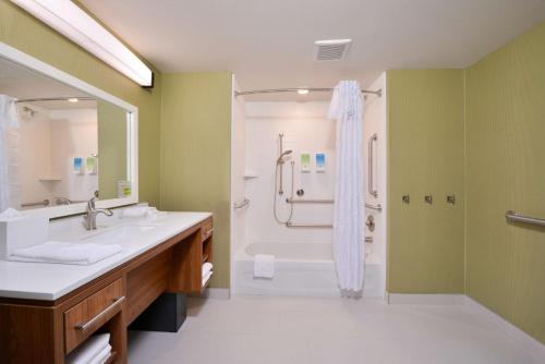 a bathroom with a shower and a sink at Home2 Suites By Hilton DuPont in DuPont