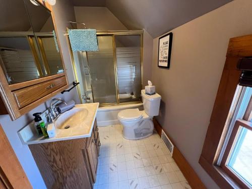 a bathroom with a sink and a toilet at Arnolds Park Iowa St Funhouse in Arnolds Park