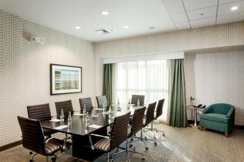a conference room with a long table and chairs at Hampton Inn & Suites by Hilton Seattle/Northgate in Seattle