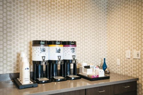 a coffee maker on a counter in a hotel room at Hampton Inn & Suites by Hilton Seattle/Northgate in Seattle