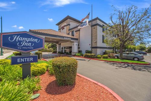 a sign in front of a hampton inn by himself at Hampton Inn Oakland-Hayward in Hayward