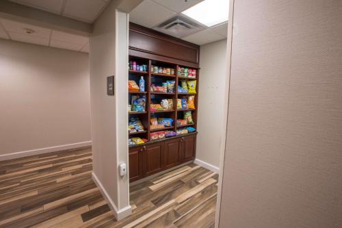 a hallway with a pantry with food in it at Hampton Inn & Suites Berkshires-Lenox in Lenox