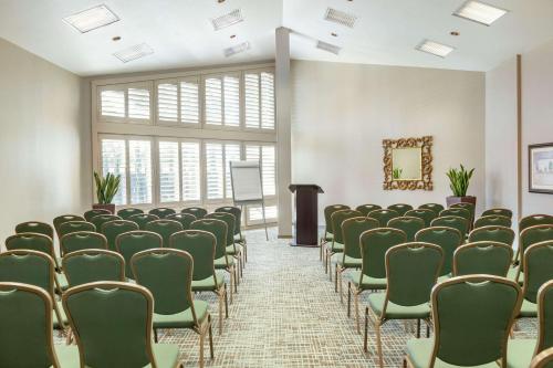 an empty room with chairs and a podium at DoubleTree by Hilton Campbell - Pruneyard Plaza in Campbell