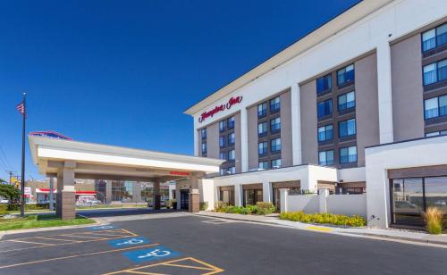 a hotel with a mobil gas station in a parking lot at Hampton Inn Salt Lake City Downtown in Salt Lake City