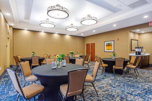 a conference room with tables and chairs in a room at Hampton Inn Salt Lake City Downtown in Salt Lake City