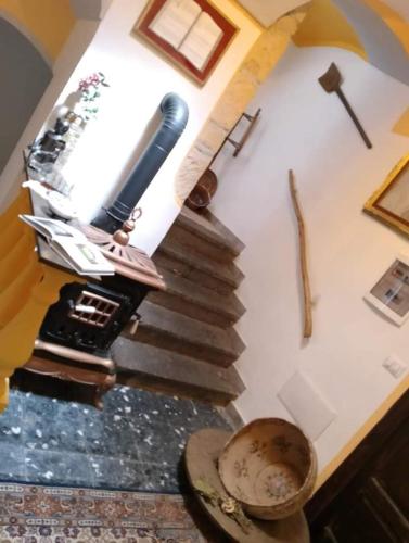 an overhead view of a staircase in a room at B&b Ammentos in Magomadas