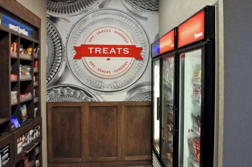 a treats sign on the wall of a store at Hampton Inn & Suites Salt Lake City-West Jordan in West Jordan