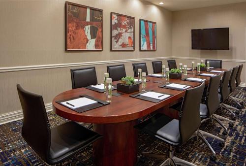 a conference room with a large wooden table and chairs at Doubletree Suites by Hilton Salt Lake City in Salt Lake City