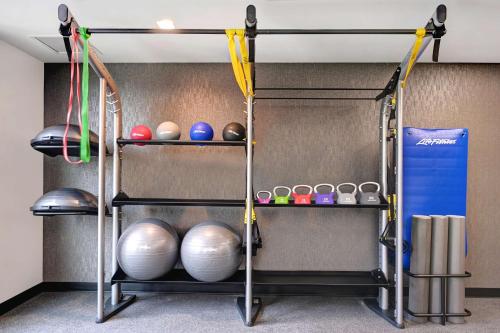 a shelf with balls and other items on it at Hilton Garden Inn Anaheim Resort in Anaheim