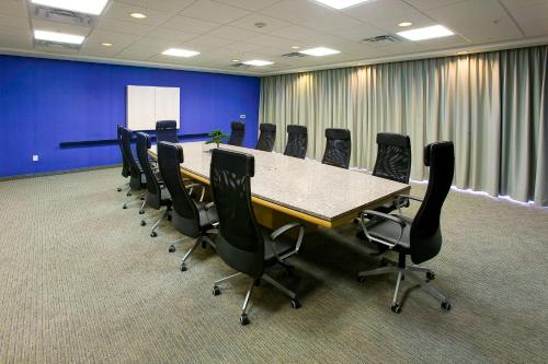 a conference room with a long table and chairs at Hampton Inn & Suites Sarasota / Bradenton - Airport in Sarasota