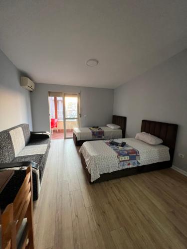 En eller flere senge i et værelse på Seaside Flats