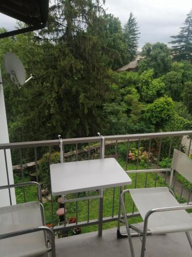 a white table and chairs on a balcony at Monastero Maggiore 2 in Cividale del Friuli