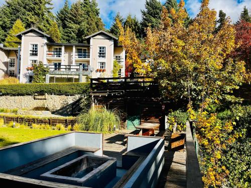 a view of the house from the backyard at Aldea Andina Hotel&Spa in San Carlos de Bariloche