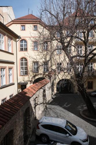 a car parked in front of a building at Opitzův dům in Prague